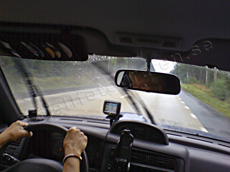 car, cars, communications, driver's seat, GPS, land communication, rear view mirror, road, roads, steering wheel, traffic, trip computer, vehicular traffic