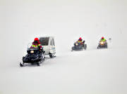 alpine rescue team, alpine rescuer, communication, communications, land communication, motor sports, mountain, mountain, snow storm, snowmobile, snowmobile, storm, storm, winter, venyr